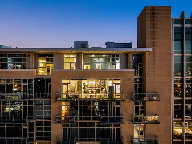 view of outdoor building at dusk