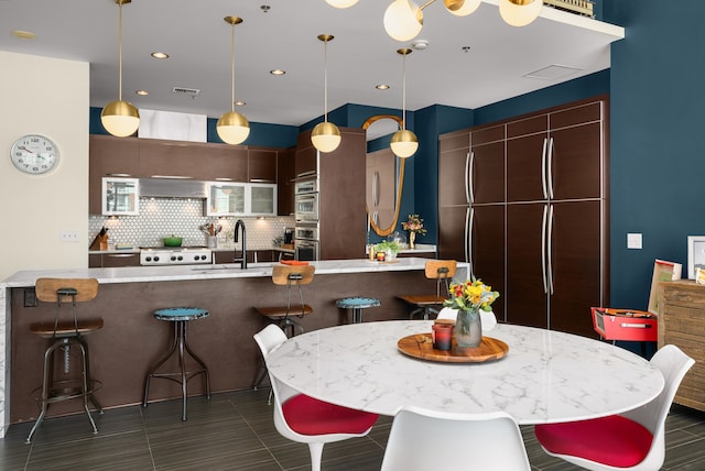 dining room featuring sink