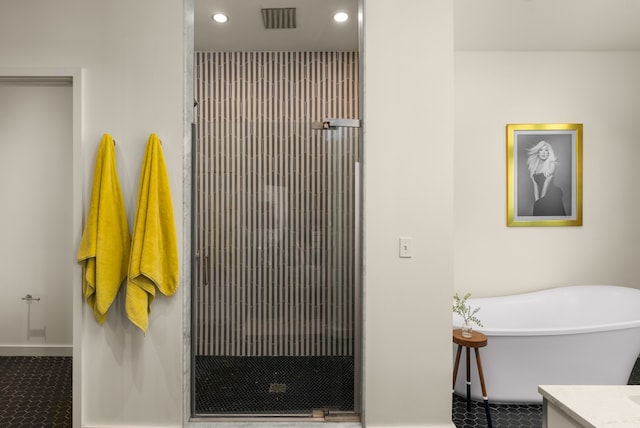 bathroom with vanity and plus walk in shower