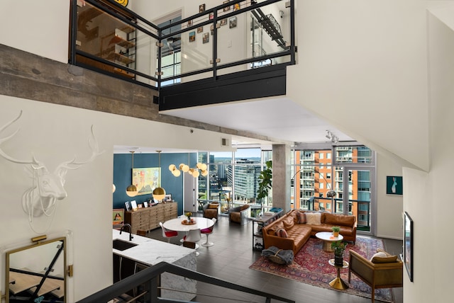 living room featuring hardwood / wood-style floors and a high ceiling