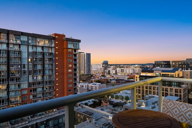 view of balcony at dusk