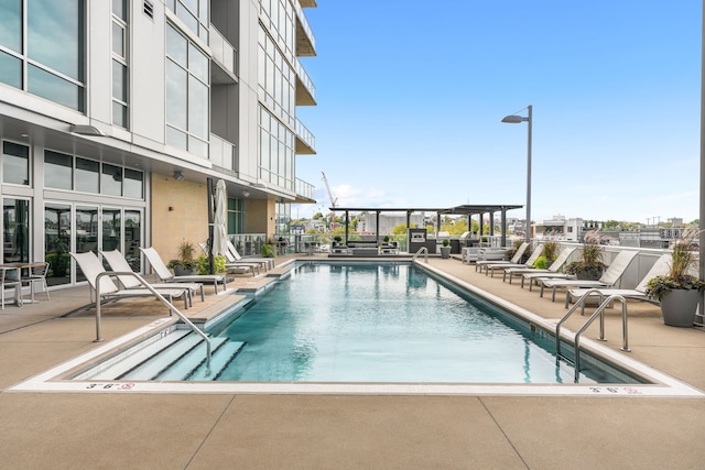 view of swimming pool with a patio area