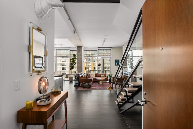 workout area with floor to ceiling windows and rail lighting