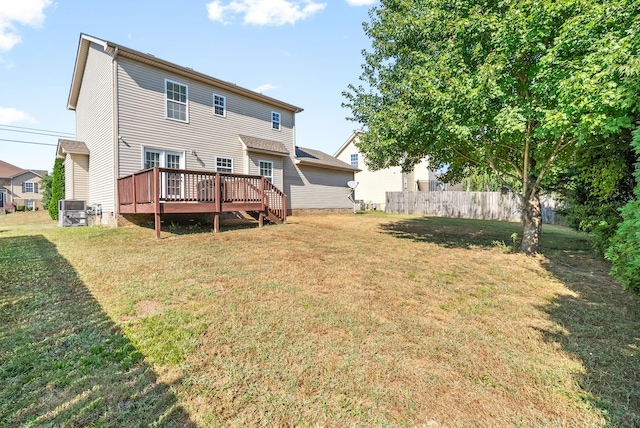 back of house featuring a yard, cooling unit, and a deck