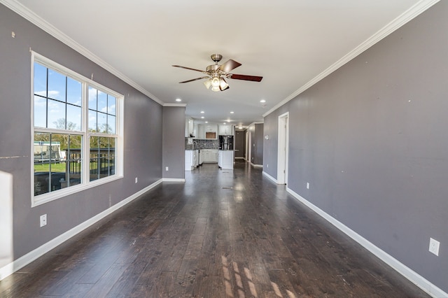 unfurnished living room with dark hardwood / wood-style floors, ceiling fan, and ornamental molding