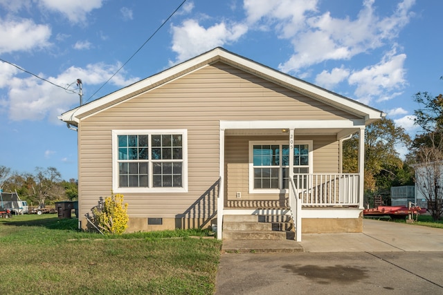 bungalow-style home with a porch and a front lawn