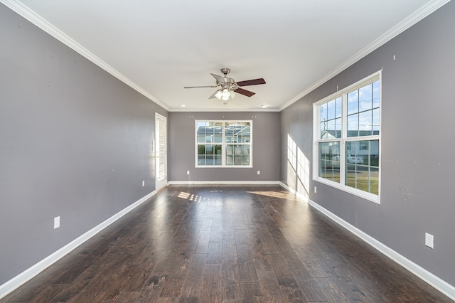 empty room featuring ceiling fan, dark hardwood / wood-style flooring, and ornamental molding