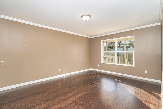 empty room with ornamental molding and dark wood-type flooring