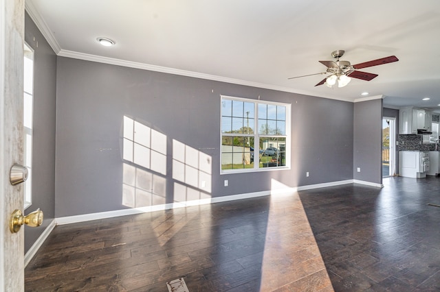 unfurnished living room with ceiling fan, crown molding, and dark hardwood / wood-style floors