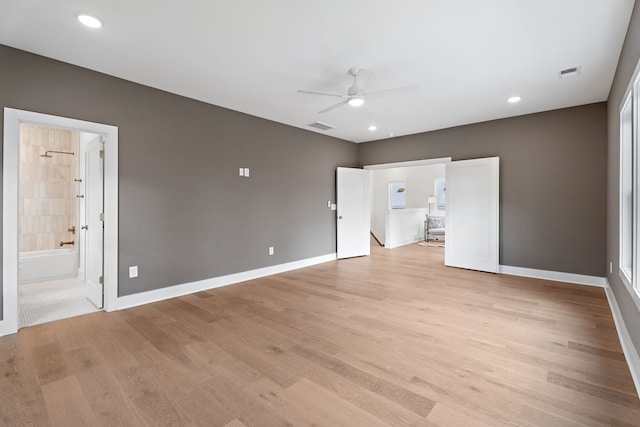 unfurnished living room with ceiling fan and light hardwood / wood-style flooring