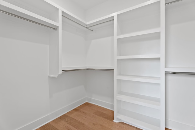 walk in closet featuring hardwood / wood-style floors