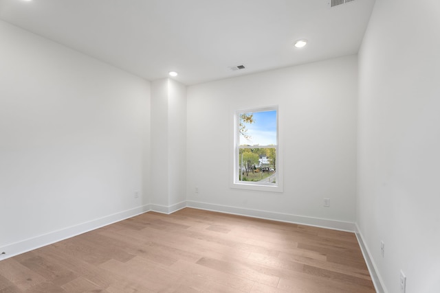 empty room with light hardwood / wood-style floors