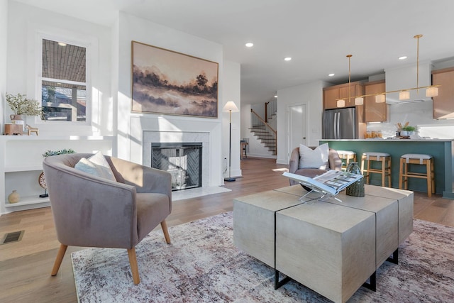 living room with light hardwood / wood-style floors