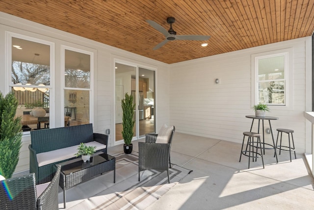 view of patio with outdoor lounge area and ceiling fan