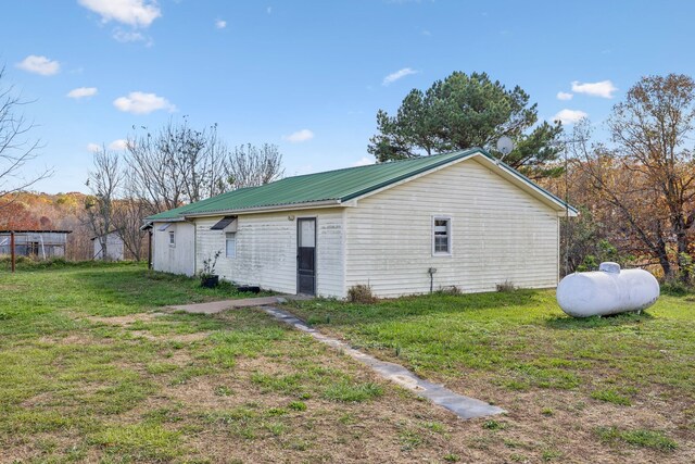 view of property exterior featuring a yard