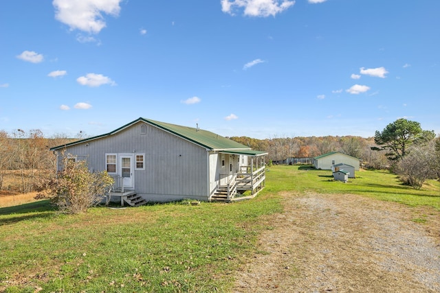 view of side of property with a yard