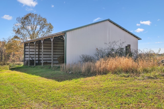 view of outbuilding featuring a lawn