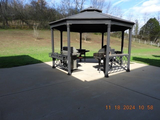 view of patio featuring a gazebo and a grill