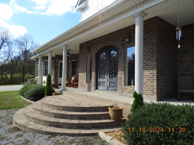 doorway to property with french doors and a porch