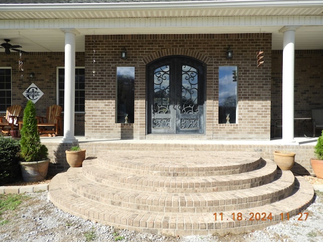 view of exterior entry featuring french doors