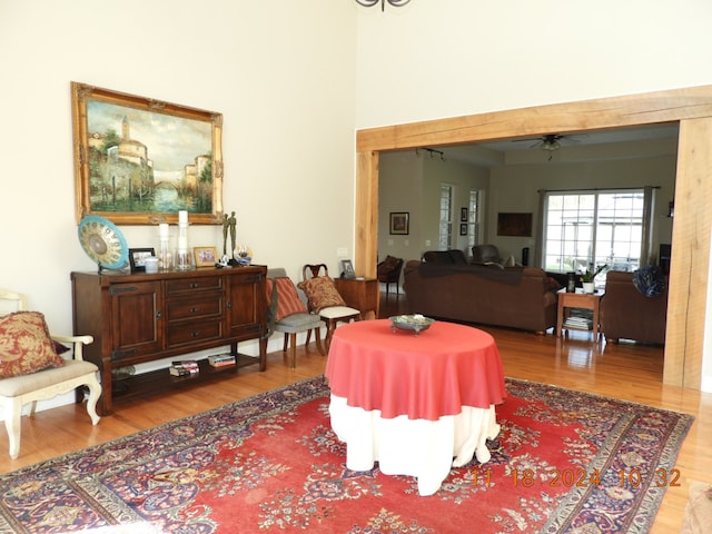 sitting room featuring hardwood / wood-style floors and ceiling fan