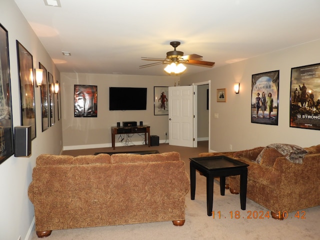 living room with light carpet and ceiling fan