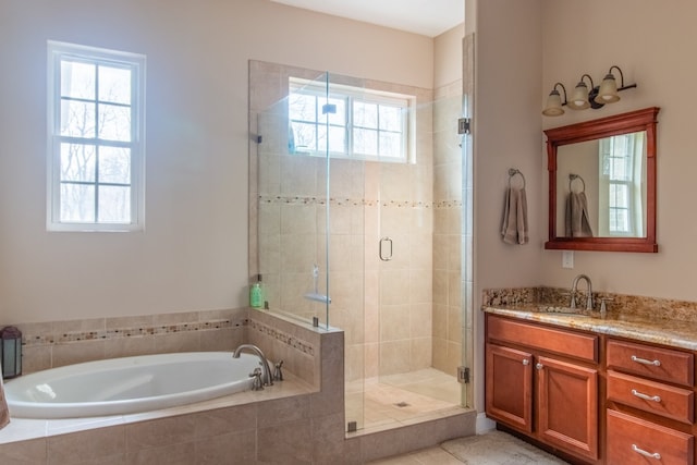 bathroom featuring vanity and plus walk in shower