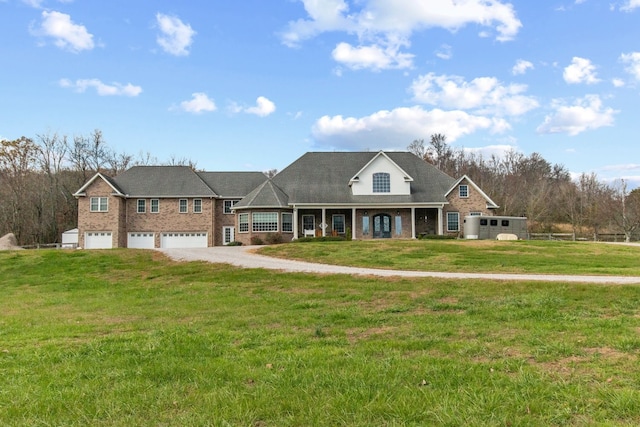 view of front of house featuring a garage and a front lawn