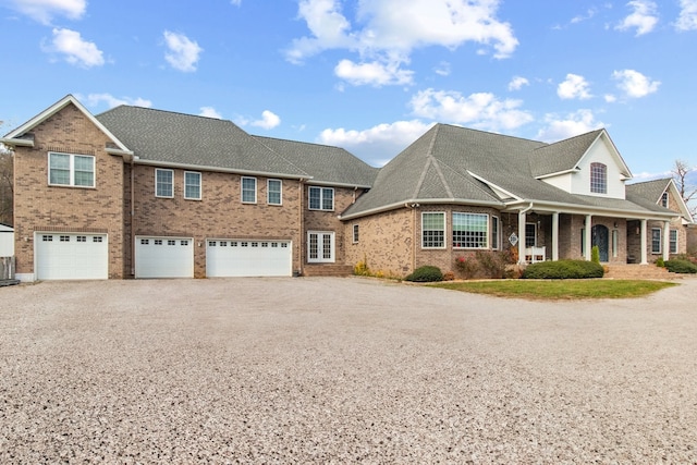 view of front of property with a porch and a garage