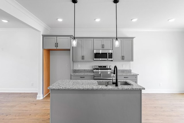 6 Charleston Cv, Clarksville, TN 37043 - kitchen with appliances with stainless steel finishes, gray cabinetry, crown molding, tasteful backsplash, and light stone counters
