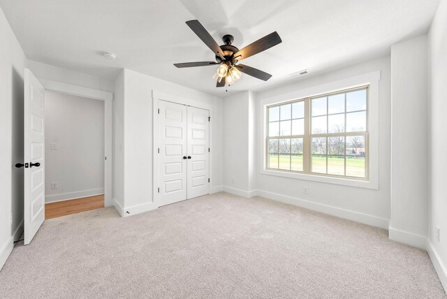 6 Charleston Cv, Clarksville, TN 37043 - unfurnished bedroom featuring light carpet, a closet, and ceiling fan