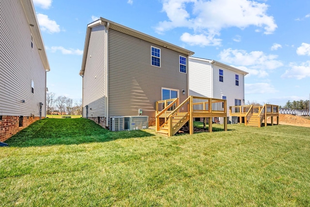 6 Charleston Cv, Clarksville, TN 37043 - rear view of property featuring stairs, a lawn, and a wooden deck