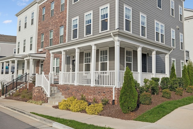 townhome / multi-family property with covered porch