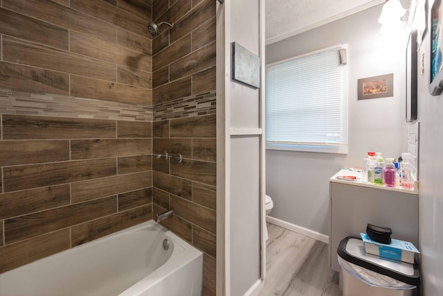 41 E 7th St, Parsons, TN 38363 - full bath with toilet, wood finished floors,  shower combination, and baseboards