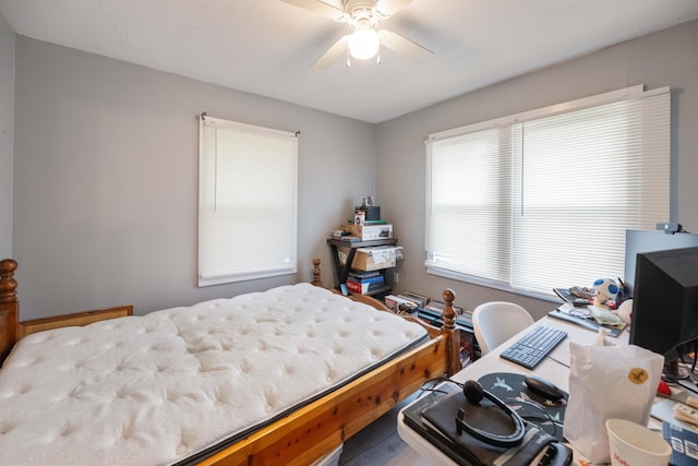 41 E 7th St, Parsons, TN 38363 - bedroom with wood finished floors and ceiling fan