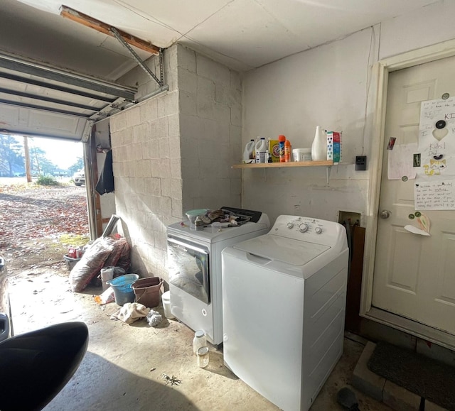 laundry room with washing machine and clothes dryer