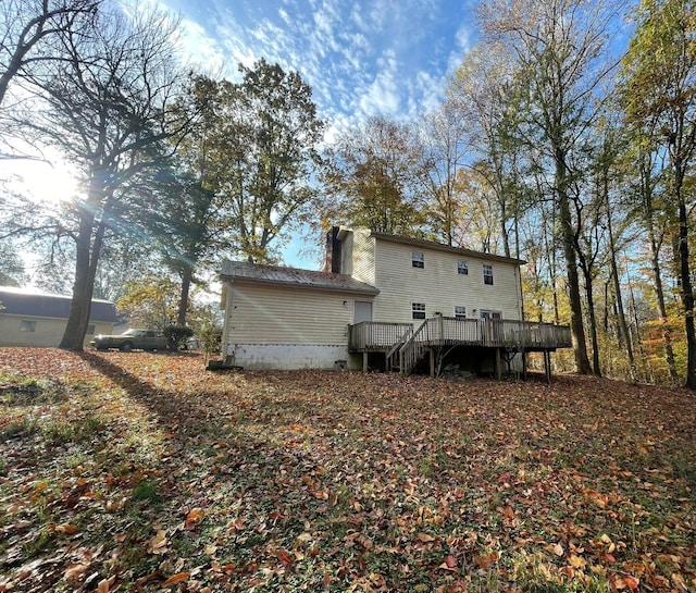 rear view of house with a wooden deck