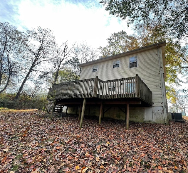 back of property featuring a deck