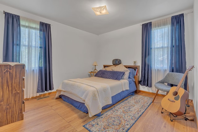 bedroom featuring wood-type flooring