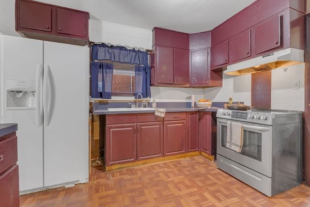 kitchen with sink, light parquet floors, white fridge with ice dispenser, and stainless steel range oven