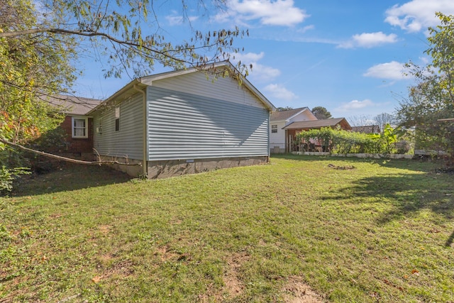 view of property exterior with a lawn