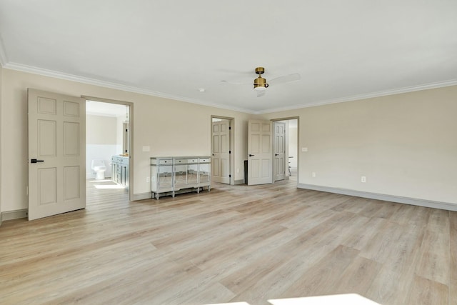 spare room with light hardwood / wood-style flooring and ornamental molding