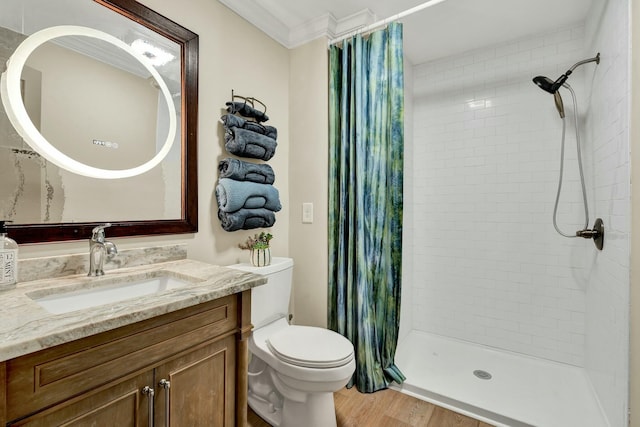 bathroom featuring hardwood / wood-style floors, vanity, toilet, and a shower with shower curtain