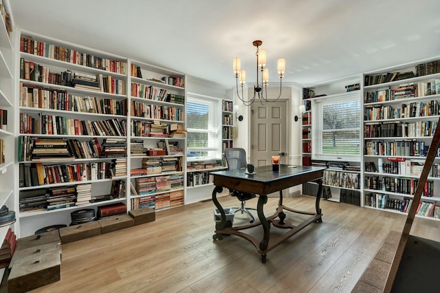 office featuring hardwood / wood-style floors and a chandelier