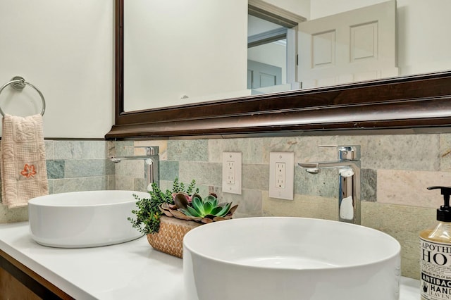 bathroom featuring vanity and tile walls