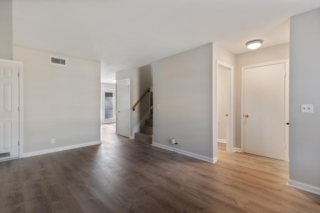 spare room with hardwood / wood-style floors