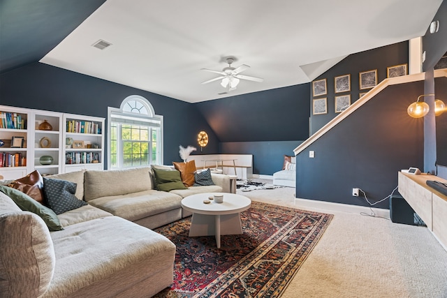 carpeted living room featuring vaulted ceiling and ceiling fan