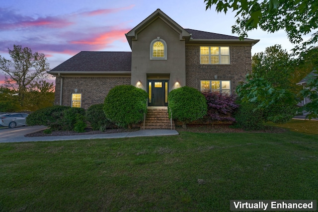 front facade with a yard