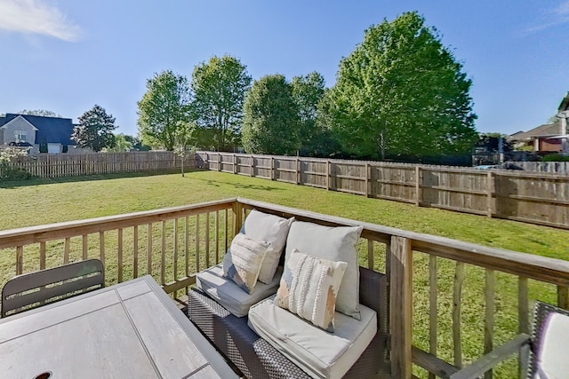 wooden terrace with a lawn