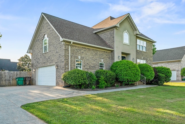 view of side of property with a garage and a yard